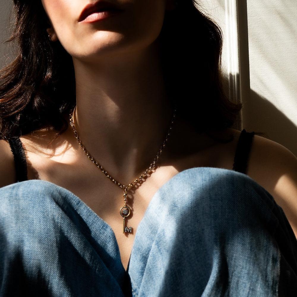 gold diamond key charm.jpg__PID:7b320a8c-b116-409c-aca5-a57d2a0f9579