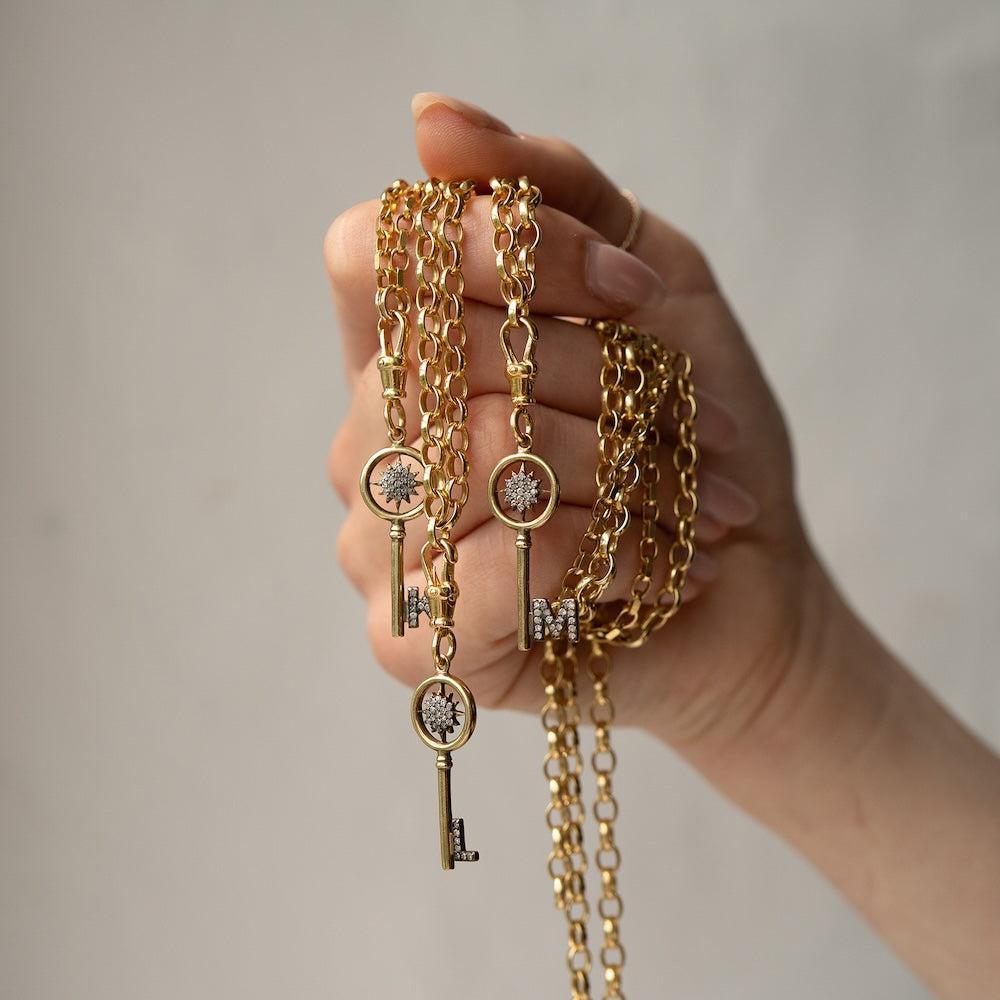 gold diamond key charms.jpg__PID:320a8cb1-16c0-4cec-a5a5-7d2a0f957981
